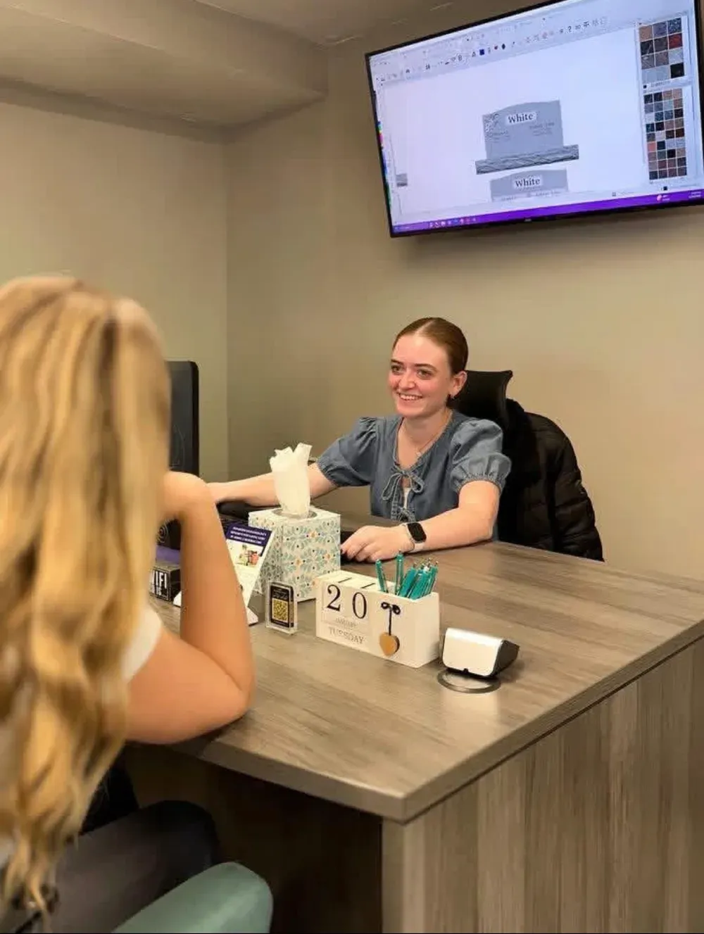 A Utah Headstone Design designer helping a family create a custom monument